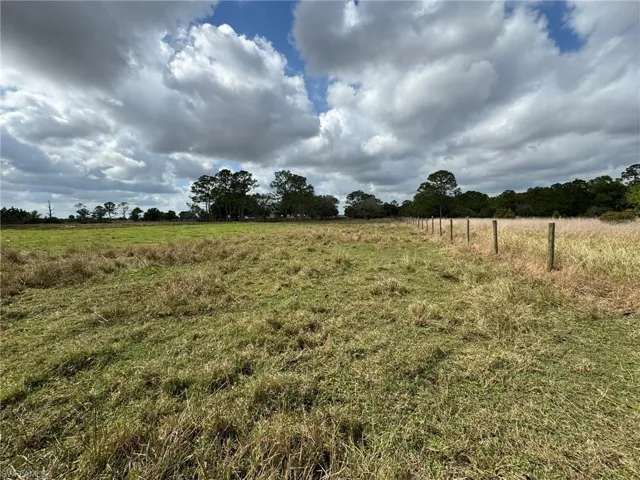 View of yard with a rural view