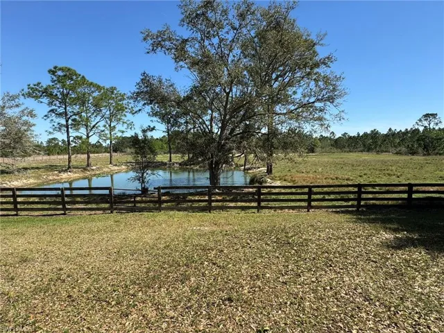 View of yard featuring a water view and a rural view