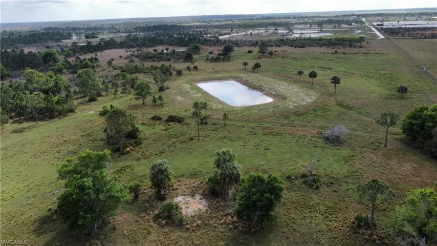 Birds eye view of property with a rural view