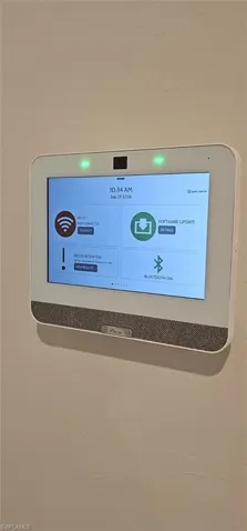Wall-mounted smart home control panel with a digital display