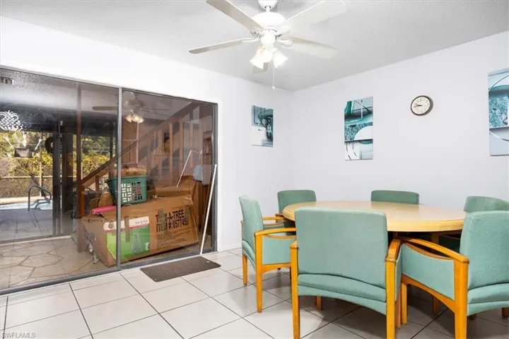 Tiled dining space with ceiling fan