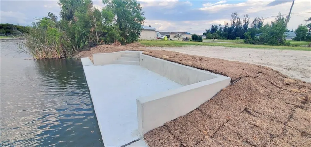 View of storm shelter with a water view