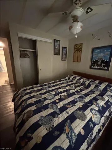 Guest Bedroom with wood look vinyl flooring.