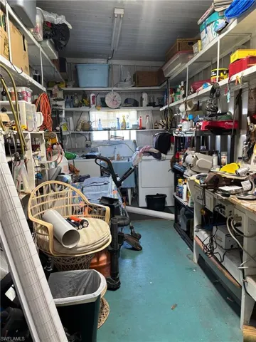 Storage room with a garage and washer / dryer