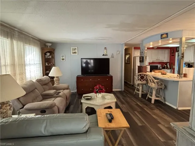Just off of the kitchen/breakfast bar with wood look vinyl flooring.