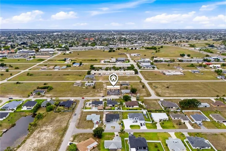 The included lot adds versatility and long-term value, providing room for expansion, parking, or future development.