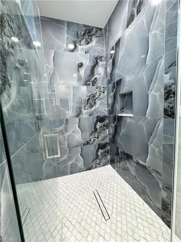 Full bath featuring visible vents and a stall shower