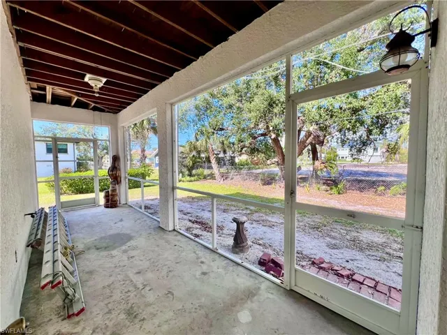 View of patio- ground level- door entry from garage