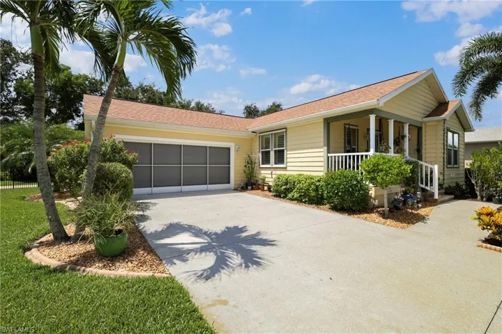 Exterior featuring a concrete driveway, attached garage with a screened door, and a covered front porch with white railings