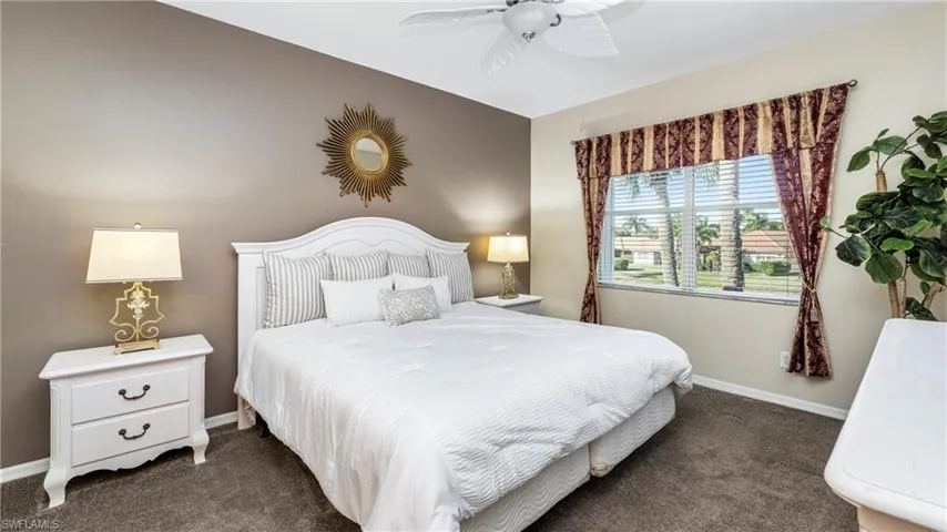 Bedroom featuring dark carpet