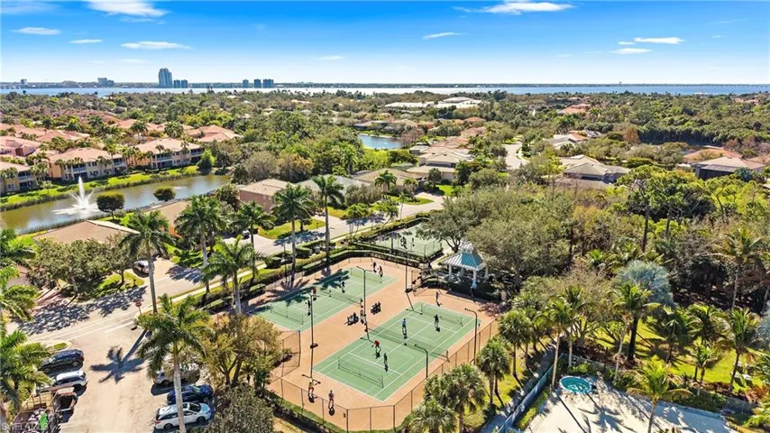 Aerial perspective of suburban area featuring a large body of water