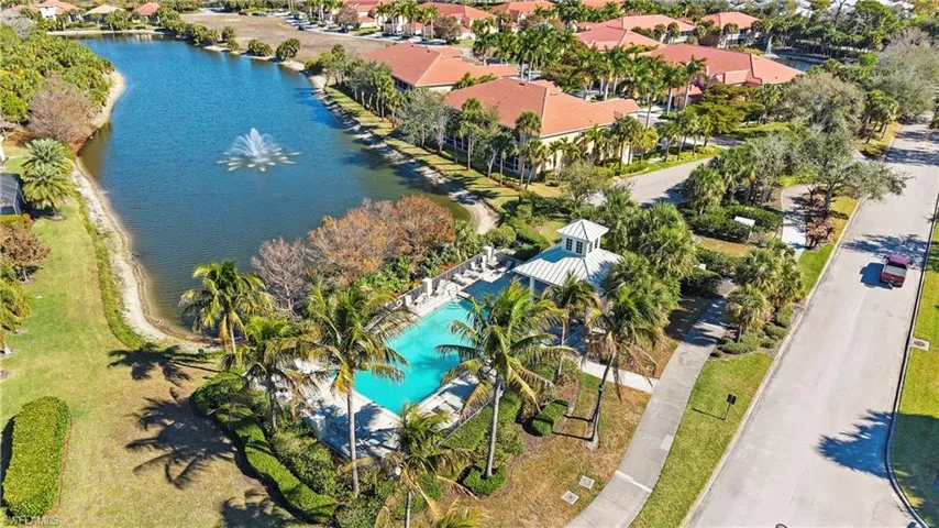 Drone / aerial view of a large body of water and a pool