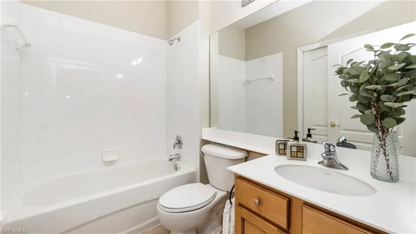 Bathroom featuring vanity and shower / bathtub combination