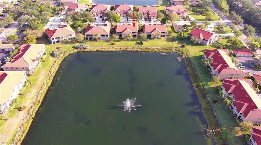 Aerial view featuring a water view and a residential view