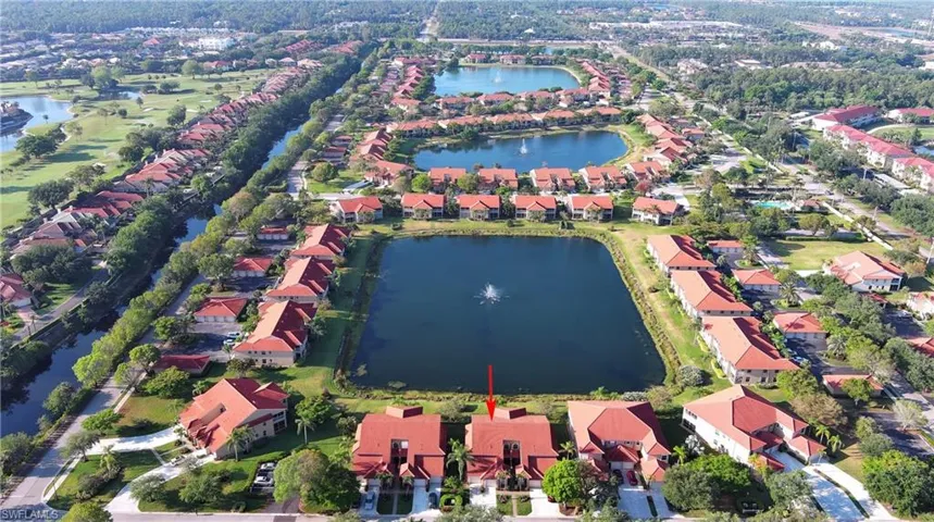 Aerial view featuring a water view and a residential view