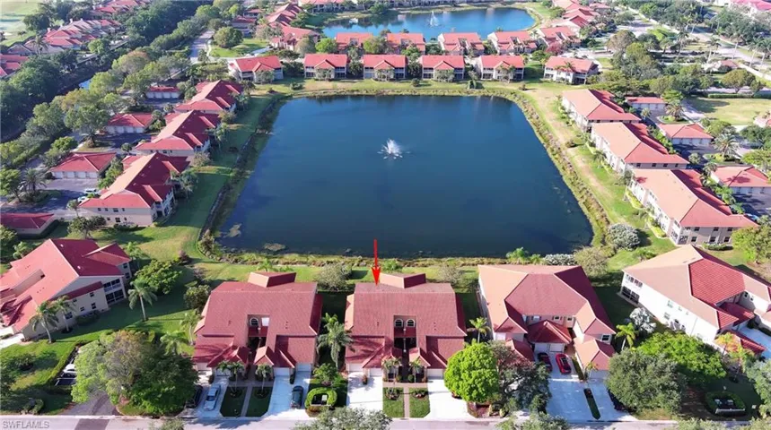 Aerial view featuring a residential view and a water view