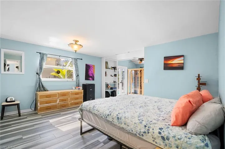 Bedroom featuring light wood-type flooring and baseboards