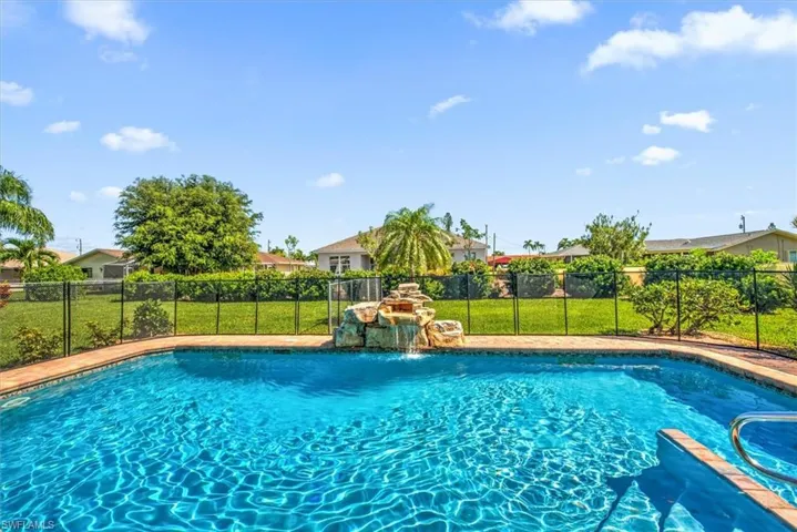 View of swimming pool featuring pool water feature