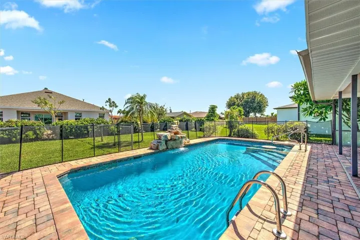 View of swimming pool featuring pool water feature