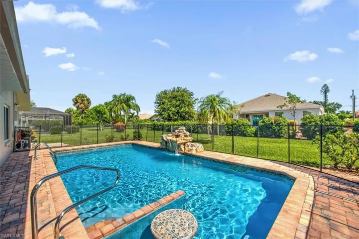 View of swimming pool featuring pool water feature