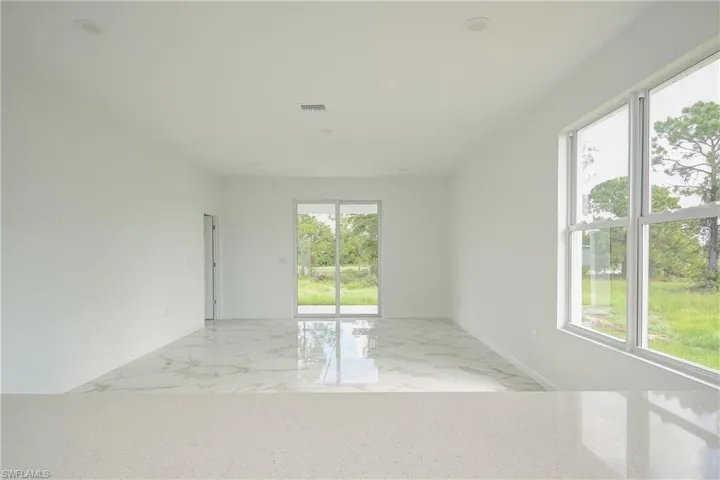 Spare room featuring a wealth of natural light