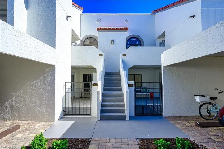 Front of condo entrance to  garden  property