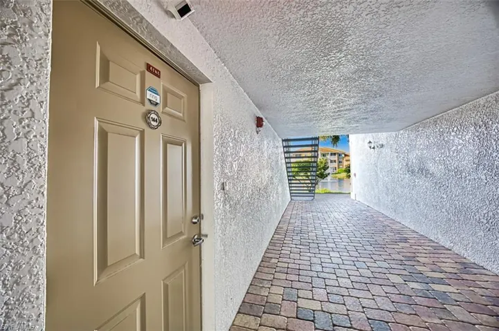 Entrance to property with a balcony