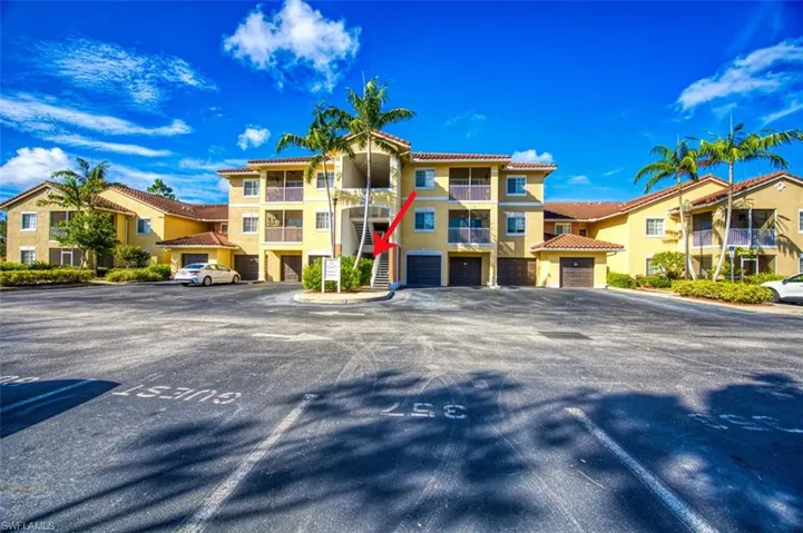 View of building exterior with a garage
