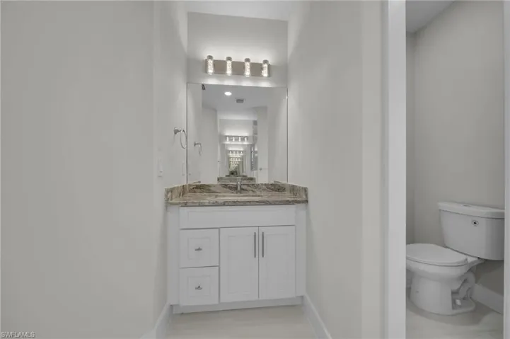 Bathroom featuring vanity and light wood-type flooring