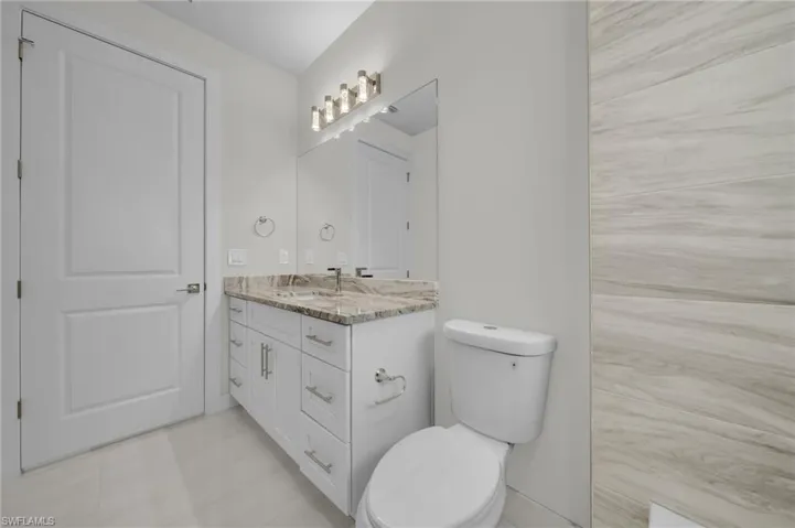 Bathroom with vanity and light tile patterned floors