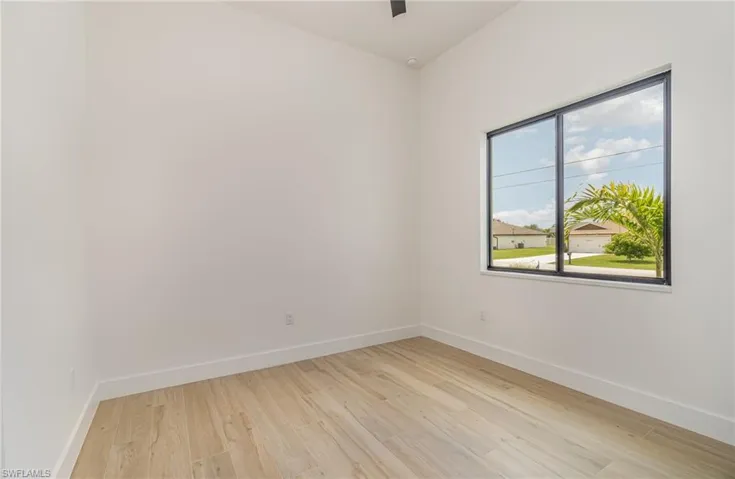 Unfurnished room with light wood-type flooring