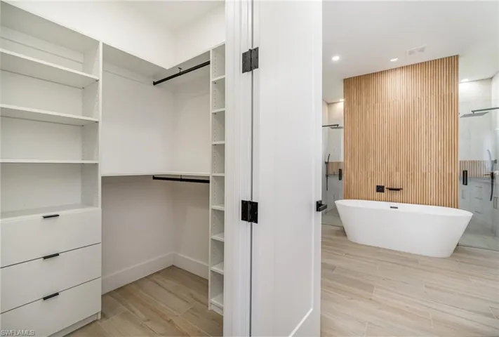 Walk in closet with a barn door