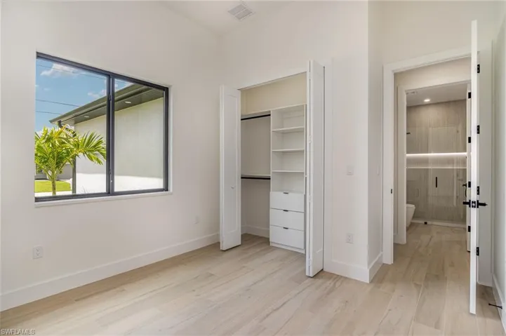 Unfurnished bedroom with light hardwood / wood-style floors