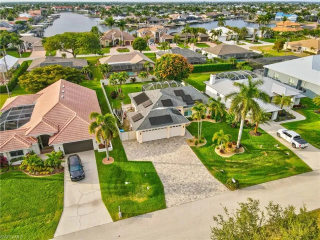 Aerial perspective of suburban area with a nearby body of water