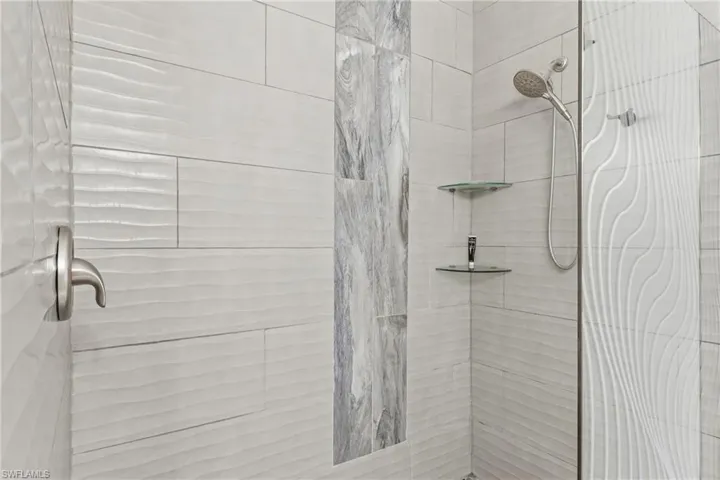 Bathroom featuring tiled shower