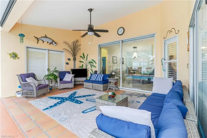 View of patio featuring an outdoor hangout area and ceiling fan