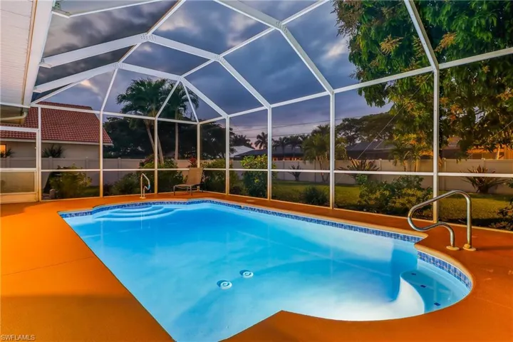 View of pool featuring a lanai screen Mansard Cage