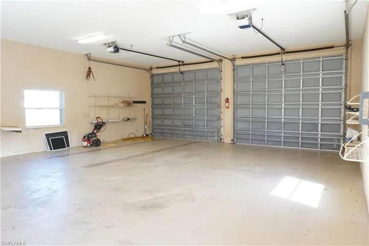 Detached garage with high doors and separate openers