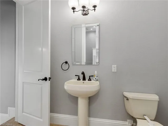 Powder room also serving as pool bath.