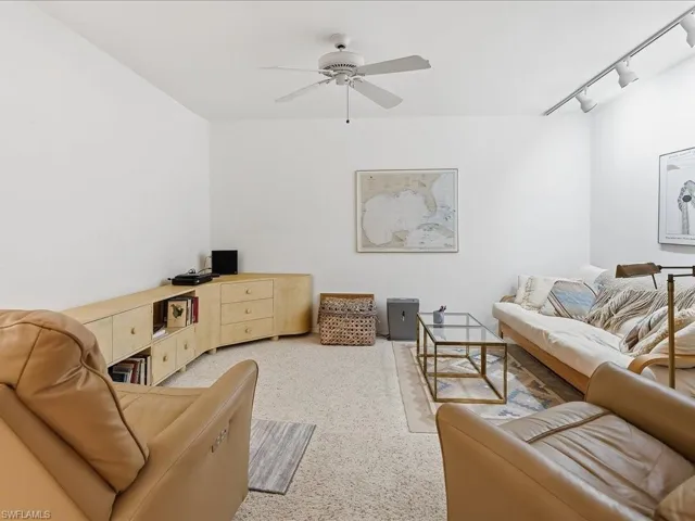 The spacious den is across from the dining area.