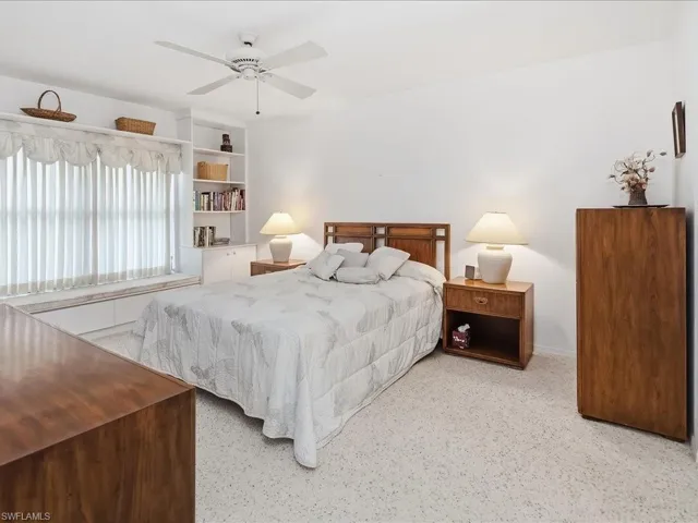 The primary bedroom is off the living room and features an en-suite bath and two walk-in closets.