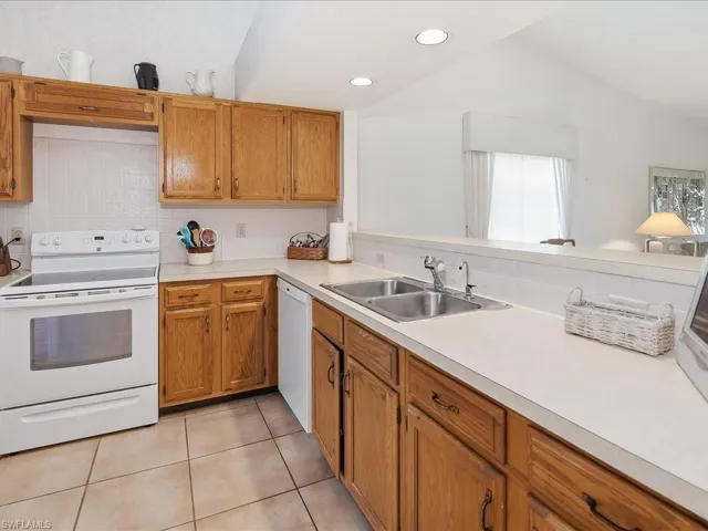 The kitchen has a large pass through that opens to the dining area for ease of entertaining.