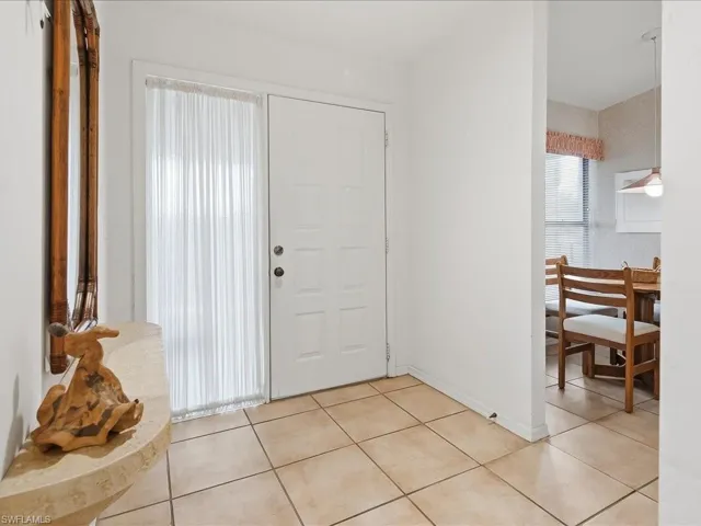 Enter from the front lanai, the eat-in kitchen is to your left.