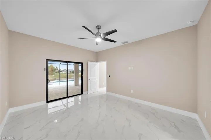 Spare room with ceiling fan