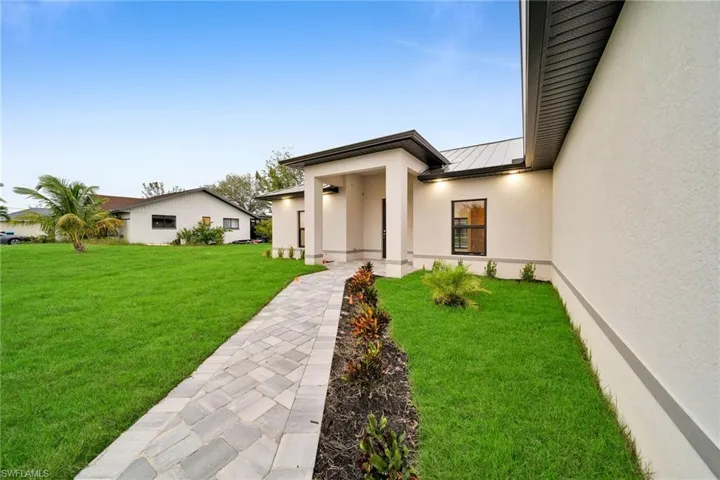 Property entrance featuring a lawn