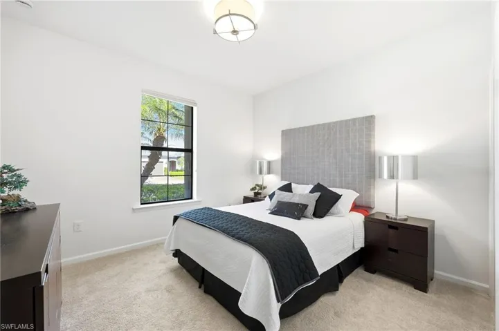 Bedroom with light carpet