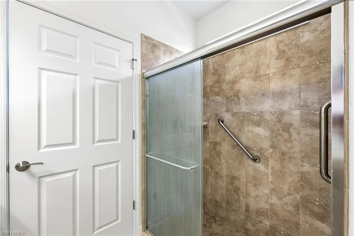 Bathroom featuring a shower stall