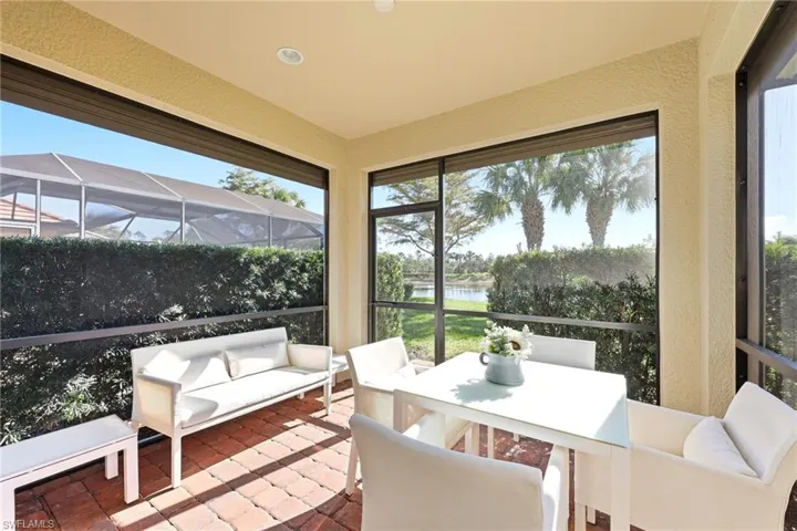 Sunroom / solarium with a water view