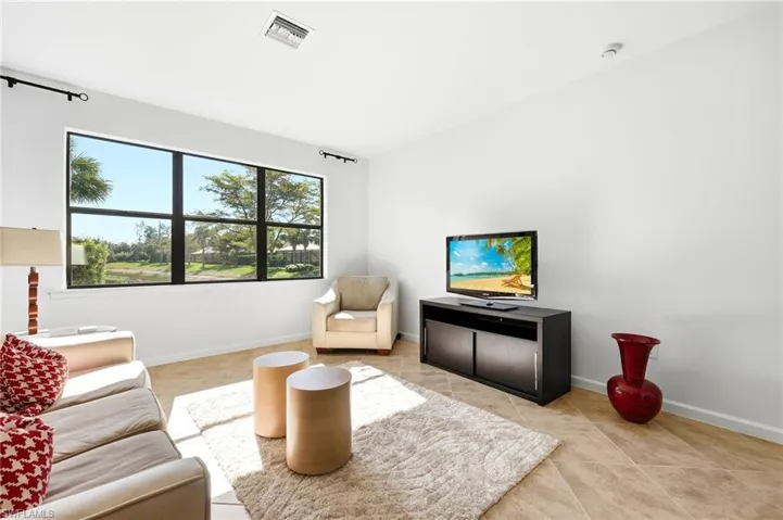 Living area with light tile patterned floors