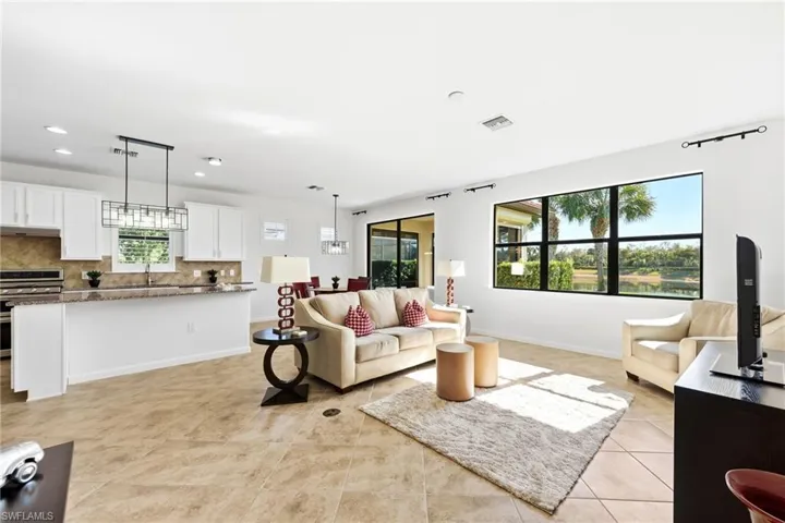 Living room with baseboards and recessed lighting